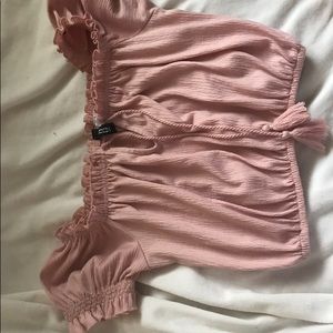 pink ruffle shirt